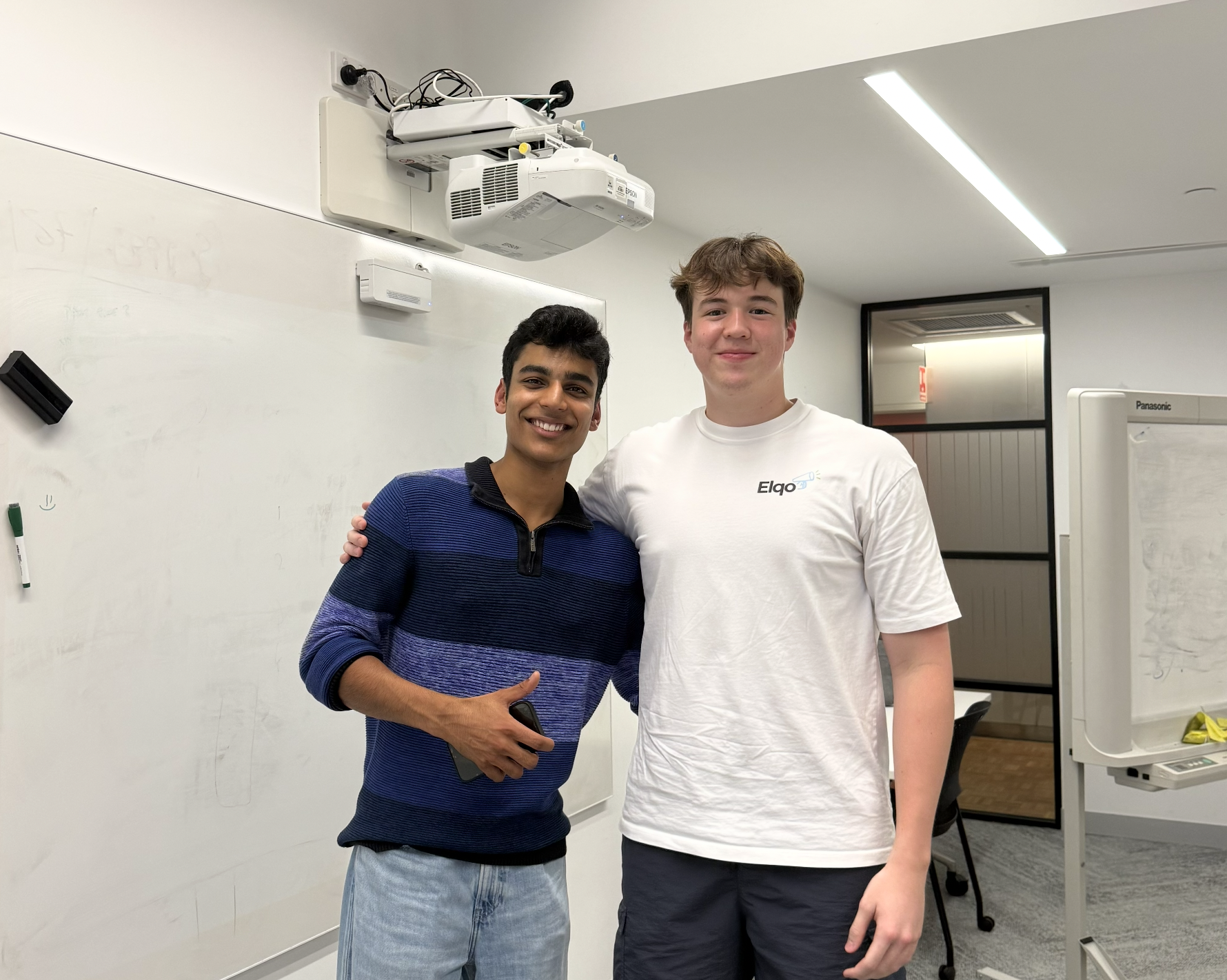 William meeting Mahir Munot at a campus event.