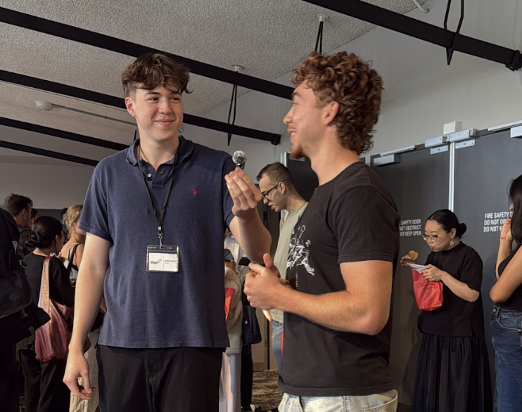 William chatting with attendees at an event.